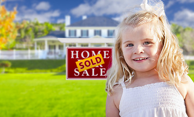 Image showing Girl in Yard with Sold Real Estate Sign and House