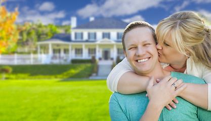 Image showing Happy Couple Hugging In Front of House