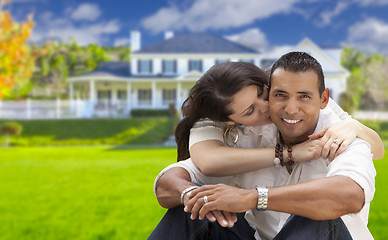 Image showing Happy Hispanic Young Couple in Front of Their New Home