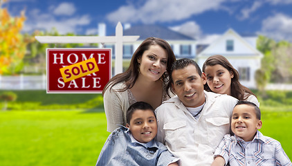 Image showing Hispanic Family in Front of Sold Real Estate Sign, House