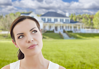 Image showing Thoughtful Mixed Race Woman In Front of House