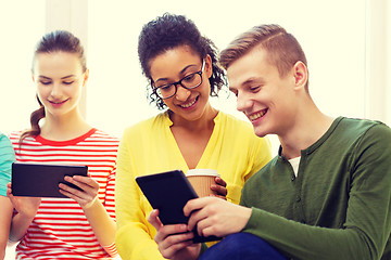 Image showing smiling students with tablet pc at school