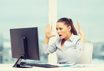 Image showing stressed woman with computer