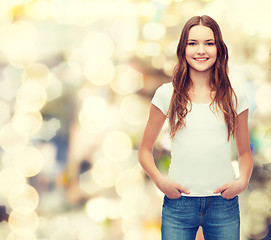 Image showing smiling teenager in blank white t-shirt