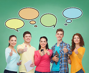 Image showing happy friends with smartphones and tablet pc