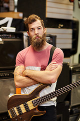 Image showing musician or customer with guitar at music store