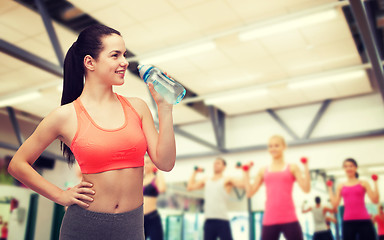 Image showing sporty woman with water bottle