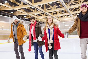 Image showing happy friends on skating rink