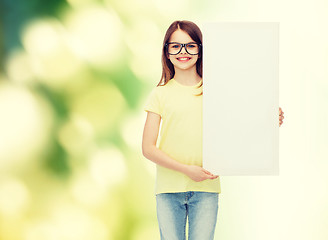 Image showing little girl wearing eyeglasses with blank board