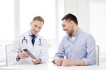 Image showing doctor with tablet pc and patient in hospital