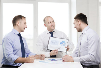 Image showing smiling businessmen with papers in office