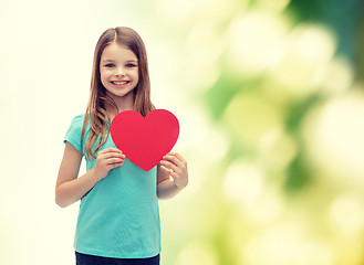 Image showing smiling little girl with red heart