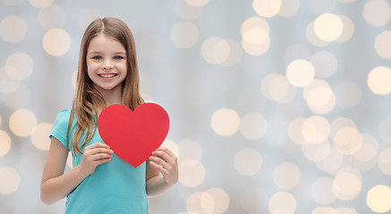 Image showing smiling little girl with red heart