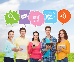 Image showing group of teenagers with smartphones and tablet pc