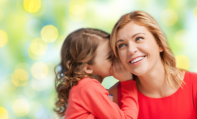 Image showing happy daughter whispering gossip to her mother