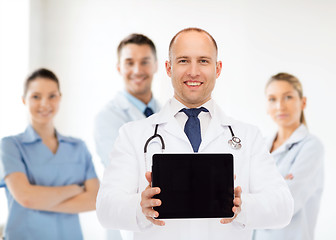 Image showing smiling male doctor with stethoscope and tablet pc