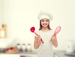 Image showing smiling girl in cook hat with ladle and whisk