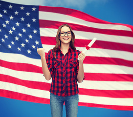 Image showing smiling female student in eyeglasses with diploma