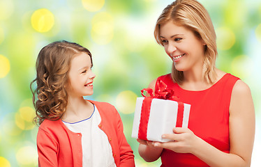 Image showing happy mother and daughter with gift box