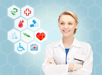 Image showing smiling doctor over medical icons blue background