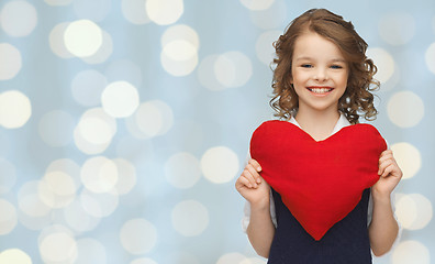 Image showing smiling little girl with red heart