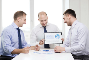 Image showing smiling businessmen with papers in office