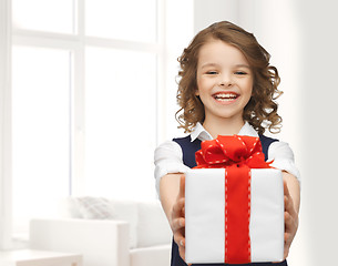 Image showing happy smiling girl with gift box