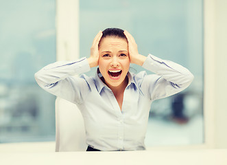 Image showing angry screaming businesswoman in office