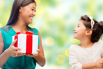Image showing happy mother and daughter with gift box