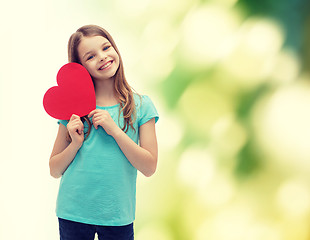 Image showing smiling little girl with red heart