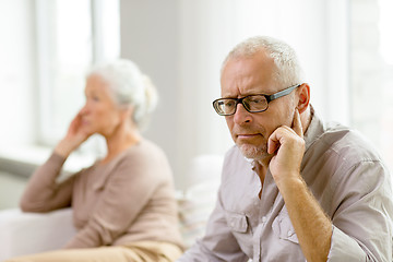 Image showing senior couple sitting on sofa at home