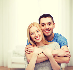 Image showing smiling couple hugging