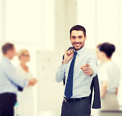 Image showing handsome buisnessman with jacket over shoulder