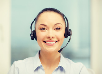 Image showing female helpline operator with headphones