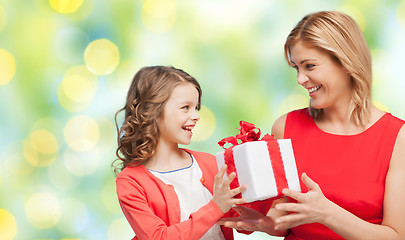 Image showing happy mother and daughter with gift box