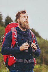 Image showing man with backpack and binocular outdoors