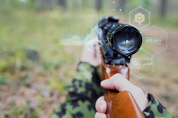 Image showing close up of soldier or sniper with gun in forest