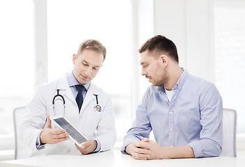 Image showing doctor with tablet pc and patient in hospital