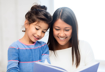 Image showing mother and daughter with book