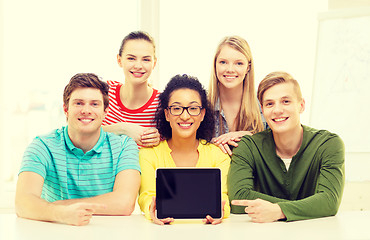 Image showing smiling students showing tablet pc blank screen