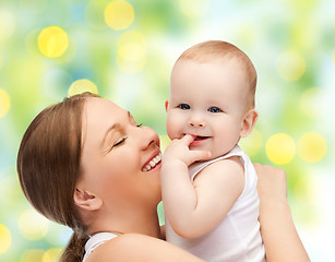 Image showing happy mother with baby over green background