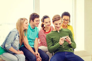 Image showing smiling students with digital camera at school