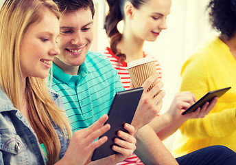 Image showing smiling students with tablet pc at school