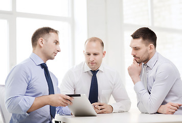 Image showing business team working with tablet pc in office