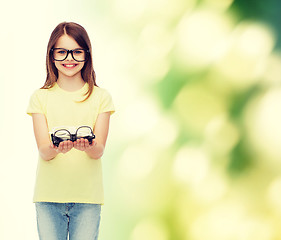 Image showing smiling cute little girl in black eyeglasses