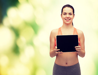 Image showing sporty woman with tablet pc blank screen