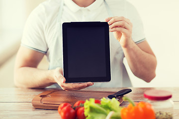 Image showing close up of male hands holding tablet pc