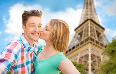 Image showing happy couple taking selfie over eiffel tower