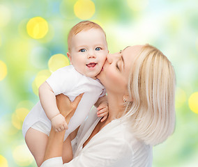 Image showing happy mother with baby over green background