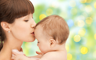 Image showing happy mother with baby over green background